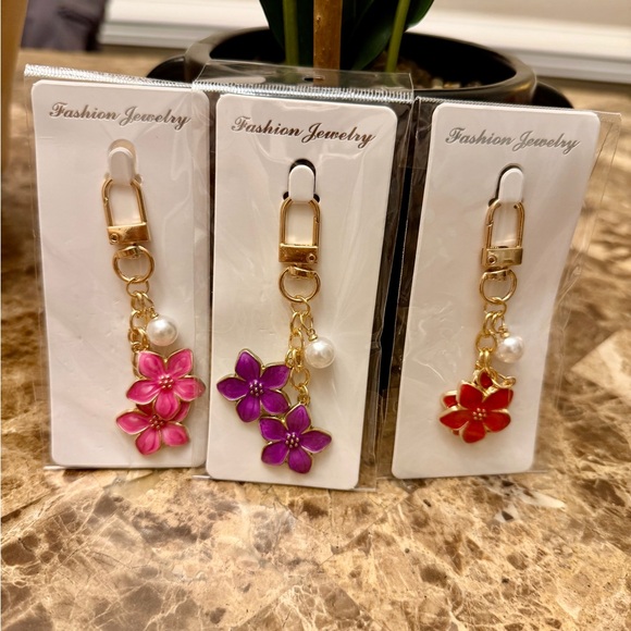 Accessories - (Your Choice) Gold Flower Bag/Keychain with Pearl Charm - Pink, Purple, or Red